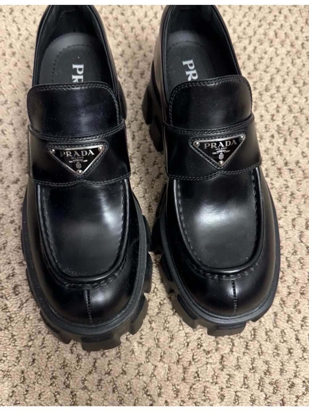Prada Black Leather Lug-Sole Penny Loafers with Triangular Logo